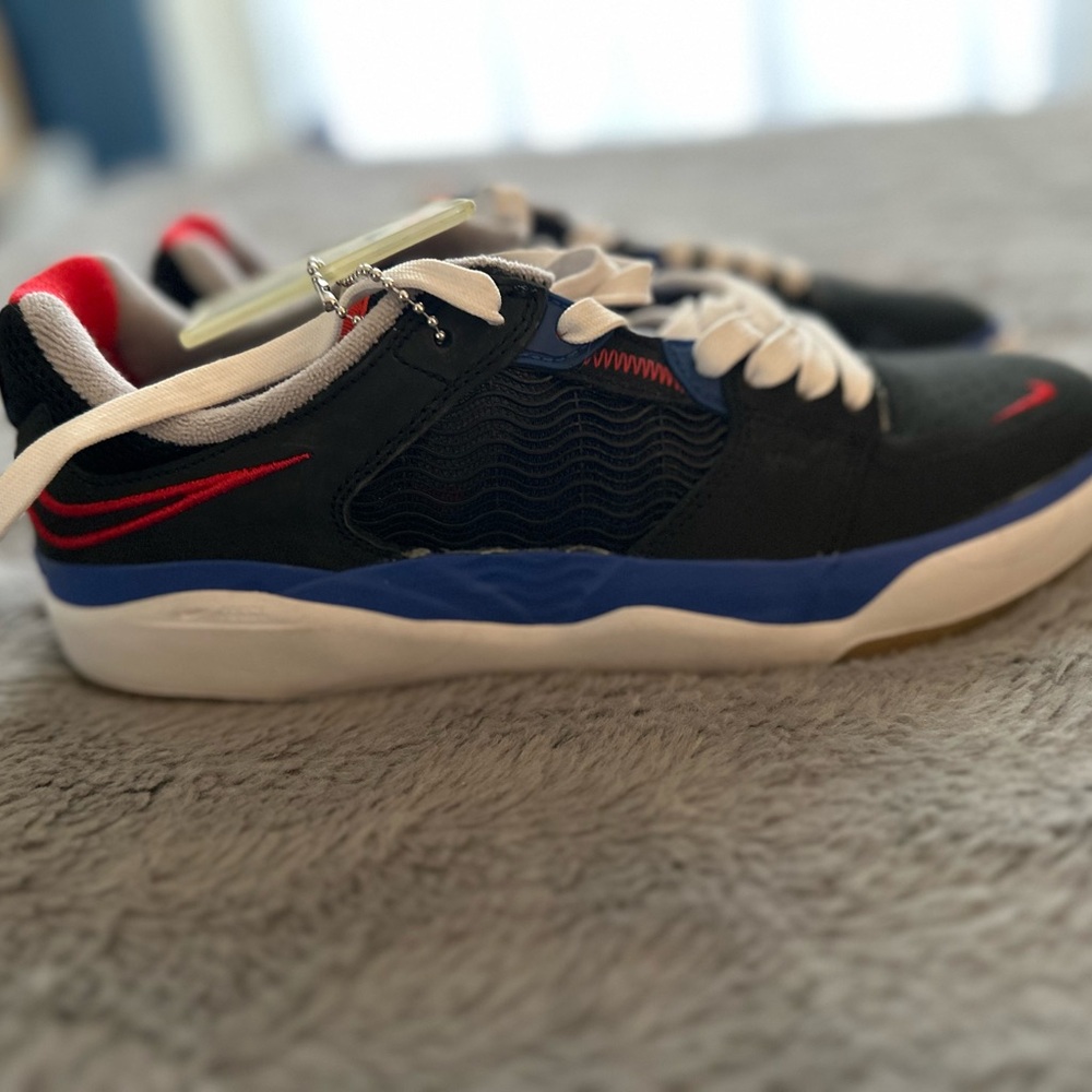 Nike Black Sneakers with Blue and Red Accents